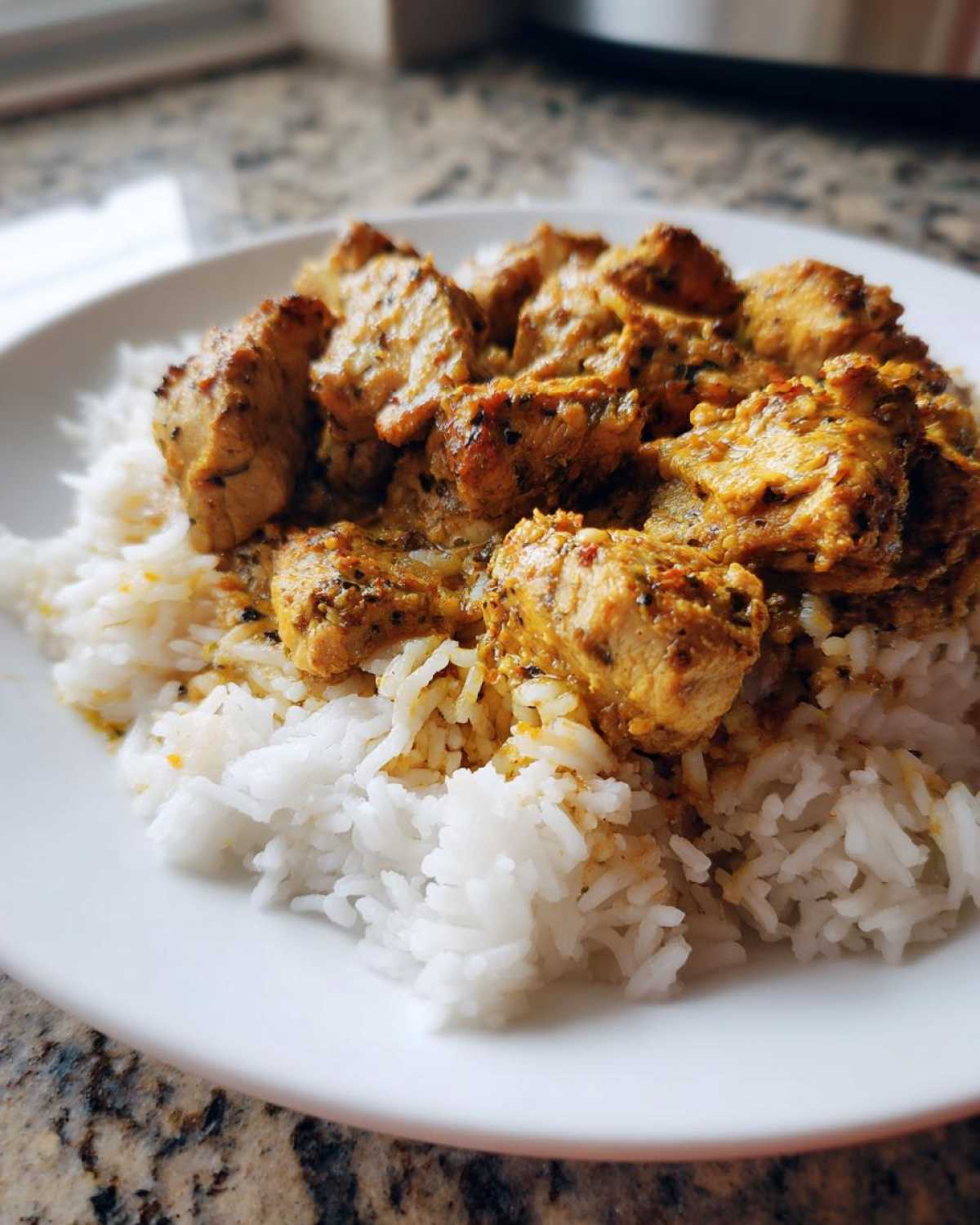 Close-up of tender chicken shawarma pieces served over fluffy white rice, showcasing the Instant Pot Chicken Shawarma Rice.