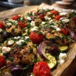 Close-up of One-Pan Mediterranean Chicken Zucchini Bake with roasted tomatoes, feta, and herbs.